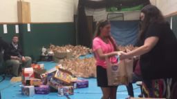 Students and teachers packing lunches at Horace Mann Middle School in Charleston, West Virginia.