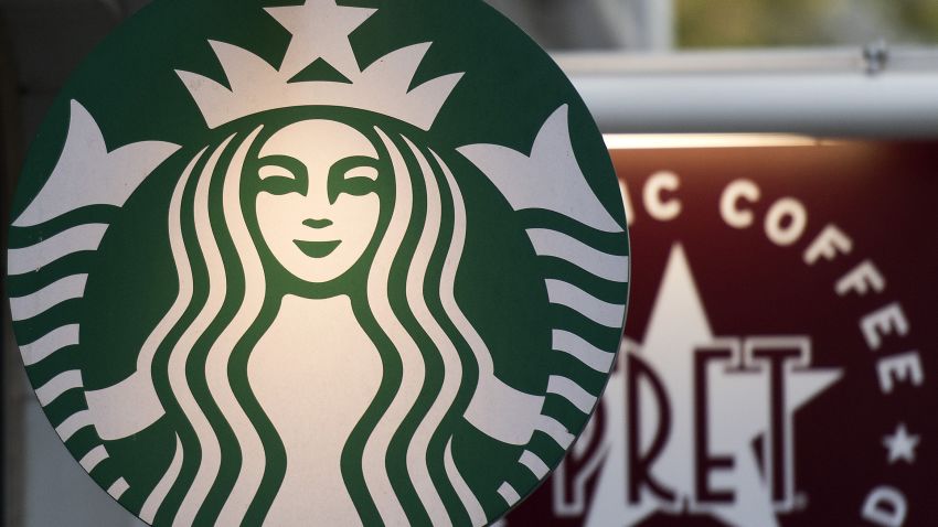 Logos are pictured on signs outside Starbucks (L) and Pret a Manger coffee shops in London on November 15, 2017.   / AFP PHOTO / Justin TALLIS        (Photo credit should read JUSTIN TALLIS/AFP/Getty Images)
