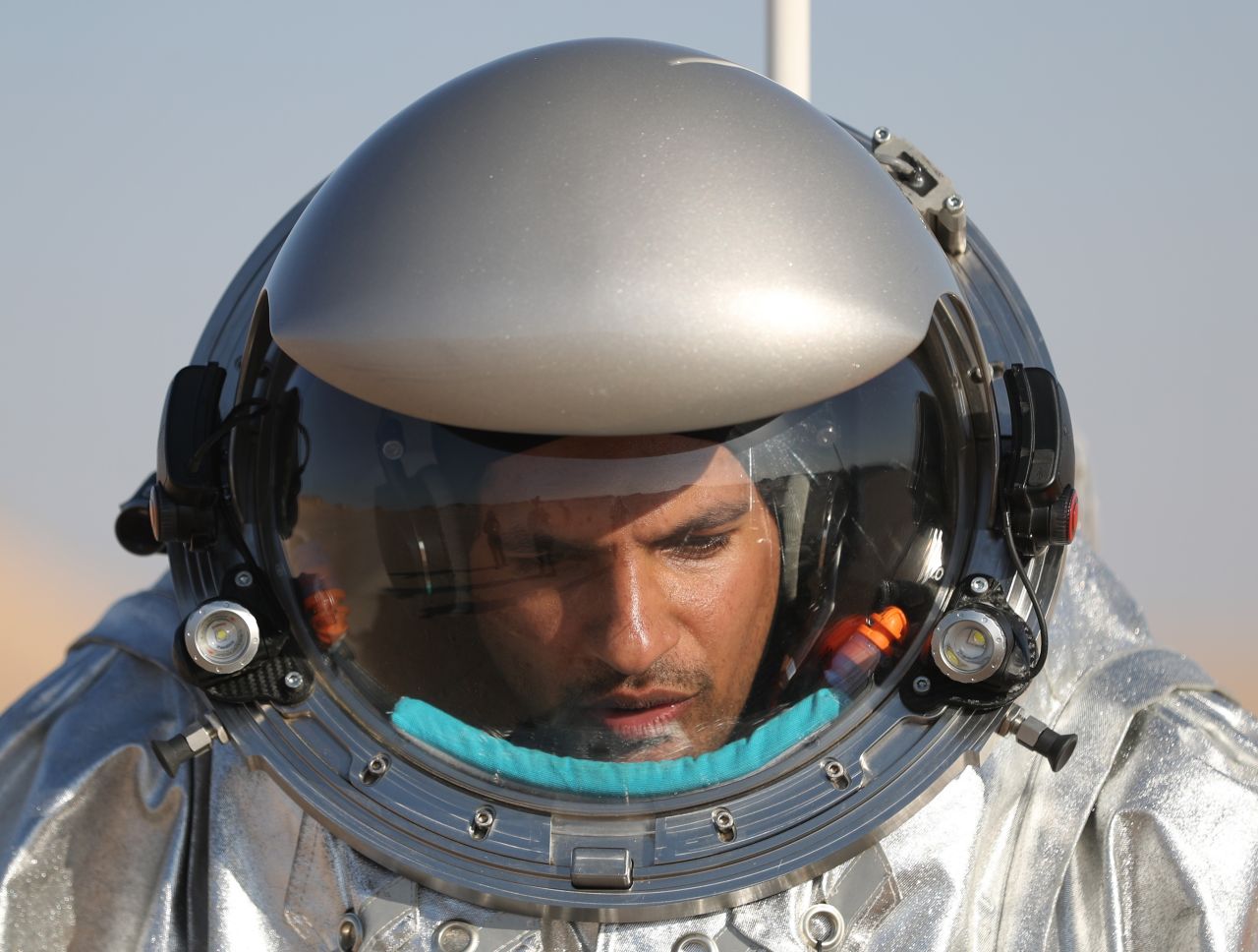 An AMADEE-18 analog astronaut heads out to conduct experiments in Oman's Dhofar region.