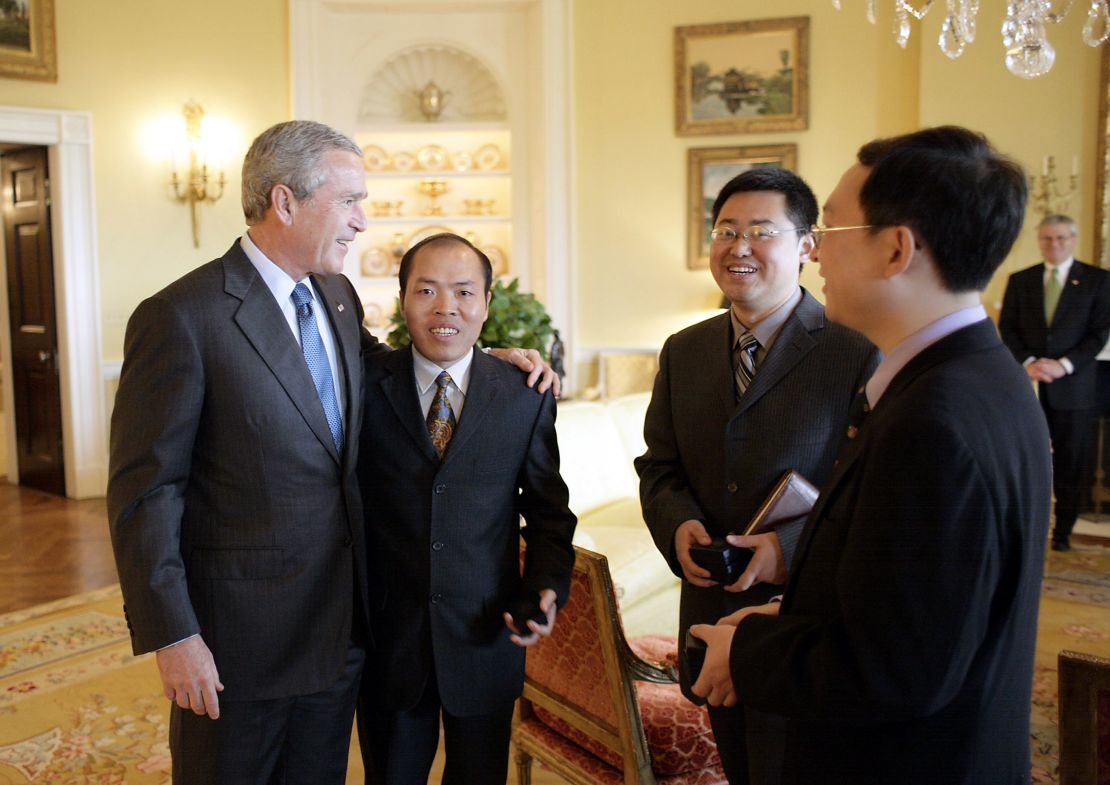 US President George W. Bush meets with Chinese Human Rights activists Li Baiguang, Wang Yi, and Yu Jie at the White House on May 11, 2006.