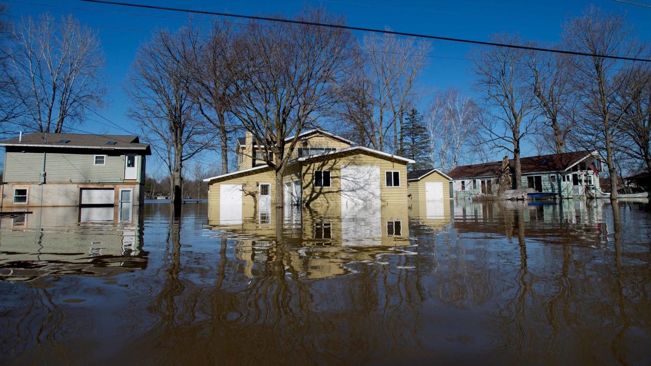 Flooding along Riverbank Avenue on Monday in Plainfield Township, Michigan.