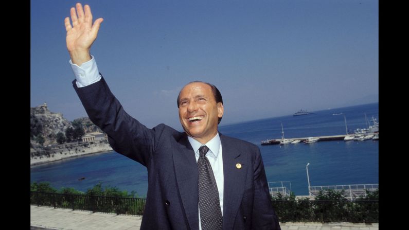 Berlusconi waves while attending a European Council meeting in Corfu, Greece, in June 1994.