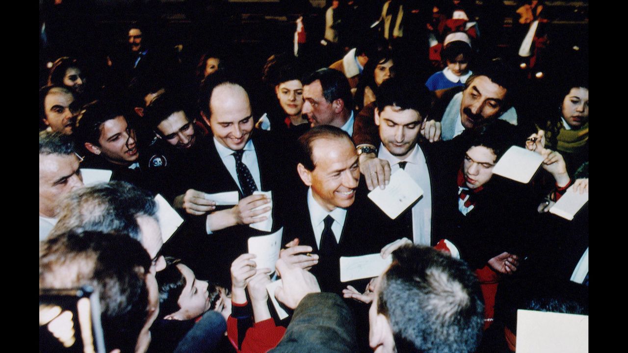 Berlusconi is surrounded by supporters during a rally in Rome in February 1994.