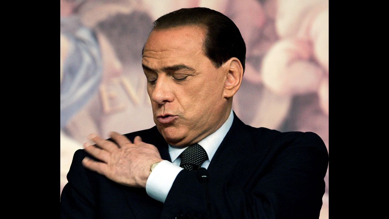 Berlusconi wipes his jacket during a news conference in Rome in 2006. He lost the election that year to Romano Prodi.