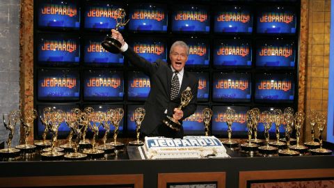 Trebek celebrates with his Emmys and cake after being inducted into The Guinness Book of World Records on November 1, 2005.