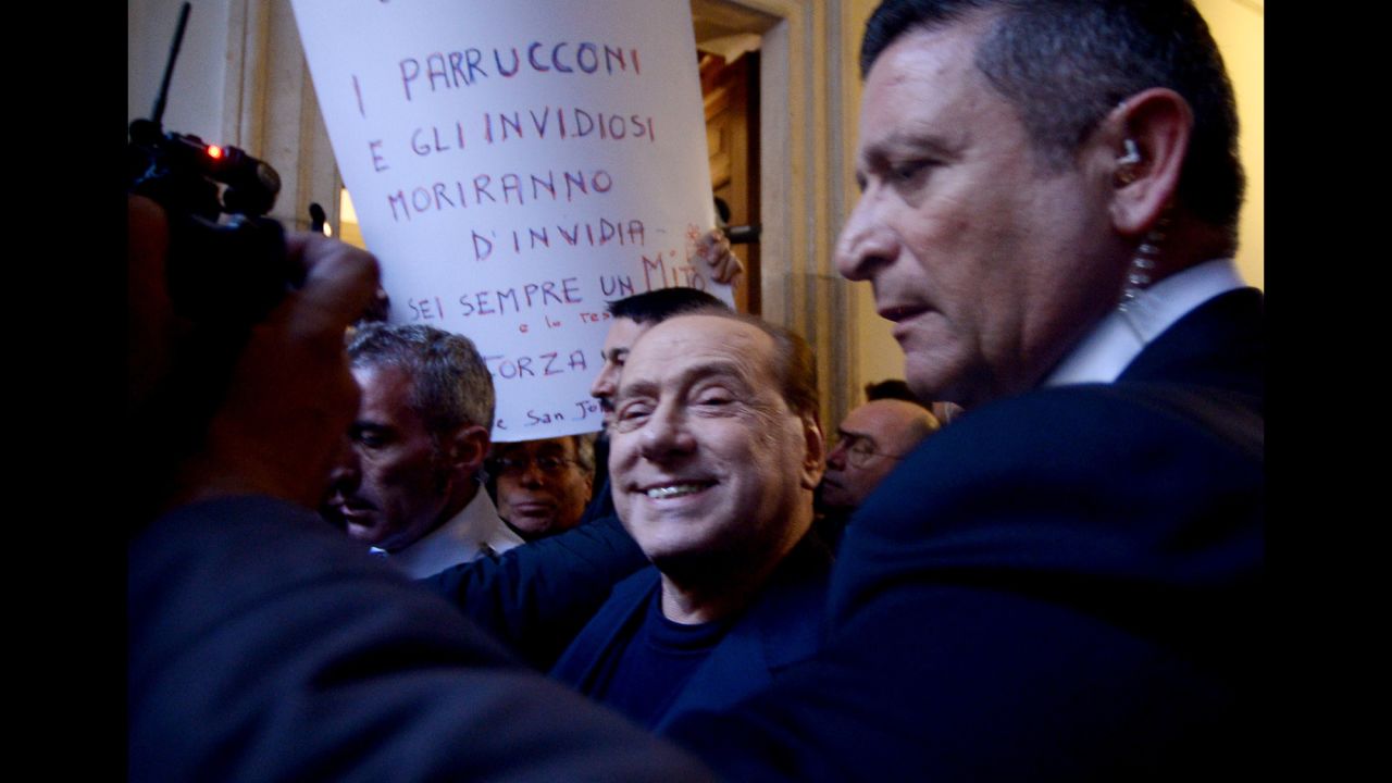 Berlusconi smiles as he arrives at his home in Rome in March 2015. Italy's top court had just cleared him of charges that he paid for sex with an underage dancer and then abused his position as prime minister to cover it up.