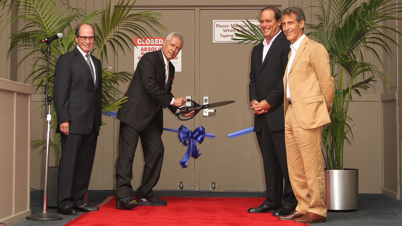 Trebek cuts the ribbon to kick off the 28th season of "Jeopardy!" on September 20, 2011, with Sony Pictures executives Harry Friedman, Steve Mosko and Michael Lynton.