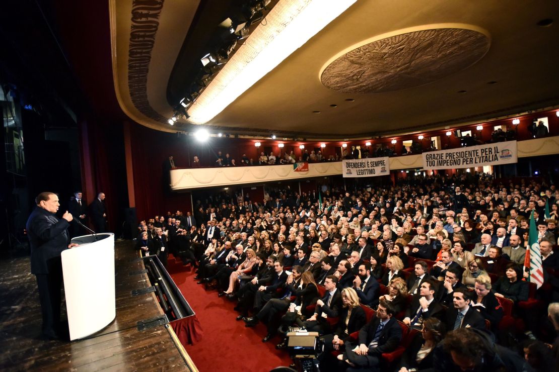 Berlusconi addresses a crowd in Milan on Sunday. 