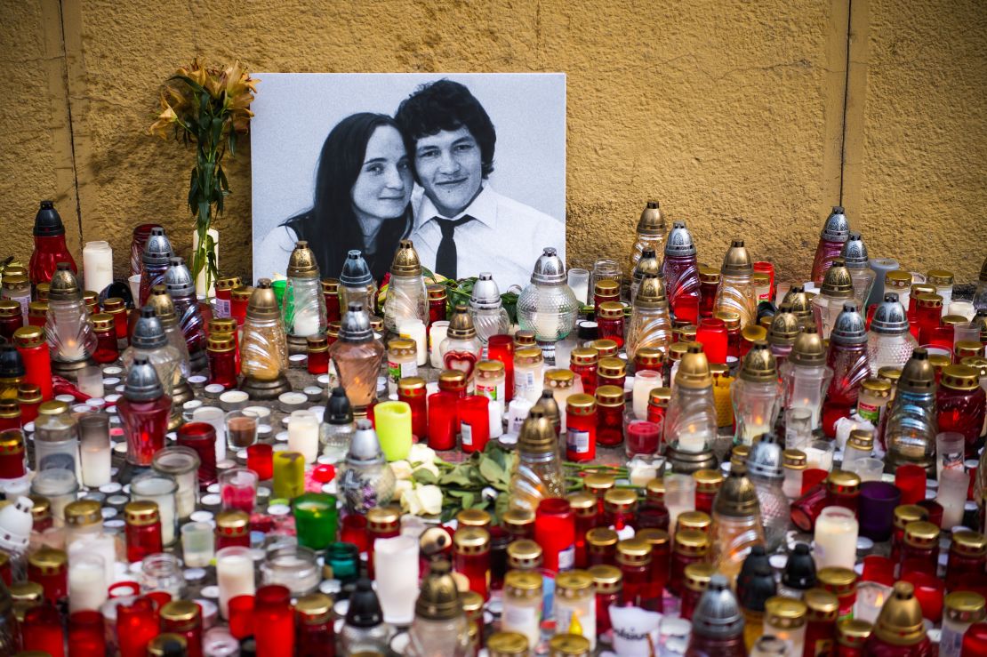 Hundreds of candles have been placed in front of a portrait of Jan Kuciak and his fiancée Martina Kušnírová in Bratislava, Slovakia.