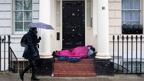 A homeless person sleeps in a doorway in London during a cold snap in February 2018.