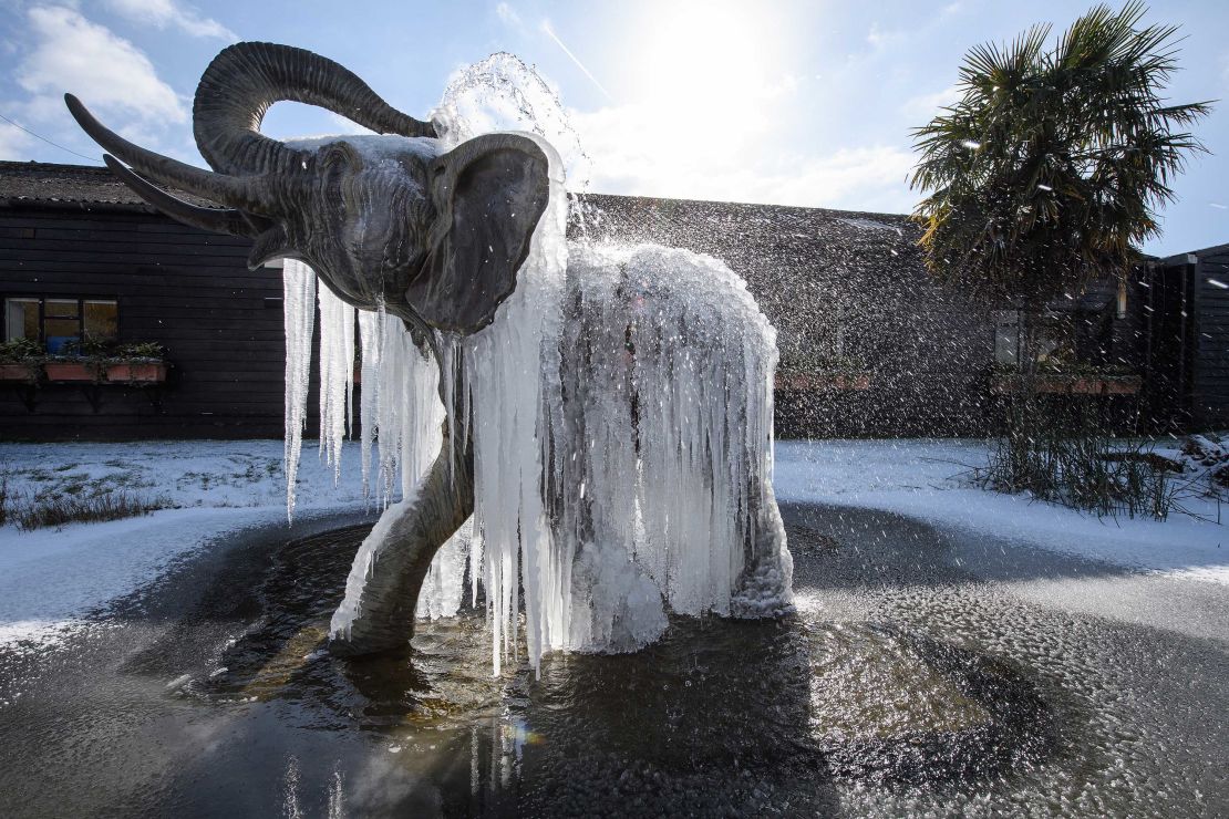 Icicles hang from a frozen elephant fountain on Tuesday in Colchester, United Kingdom. 