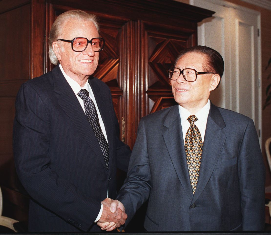 Chinese President Jiang Zemin, right, shakes hands with Reverend Billy Graham prior to a VIP luncheon on November 2, 1997 in Beverly Hills, California.