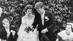 (Original Caption) John F. Kennedy and Jacqueline Bouvier cutting their wedding cake after their marriage in Newport, Rhode Island. John Kennedy was then U.S. Senator from Massachusetts. Robert Kennedy at left.