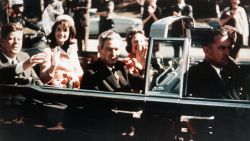 Prior to the assassination, President John F. Kennedy, First Lady Jacqueline Kennedy, and Texas Governor John Connally ride through the streets of Dallas, Texas on November 22, 1963. Included as an exhibit for the Warren Commission. (Photo by © CORBIS/Corbis via Getty Images)