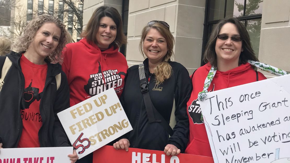 Lori Hausvater, left, with other teachers who came to the Capitol to give their views on issues.