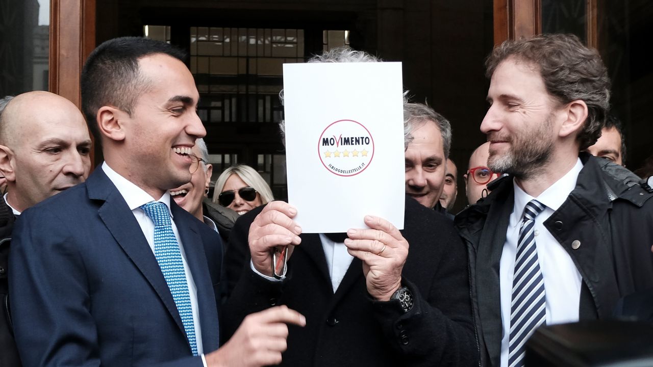 Luigi Di Maio (L) jokes with M5S founders Beppe Grillo (hidden) and Davide Casaleggio (R) in January.