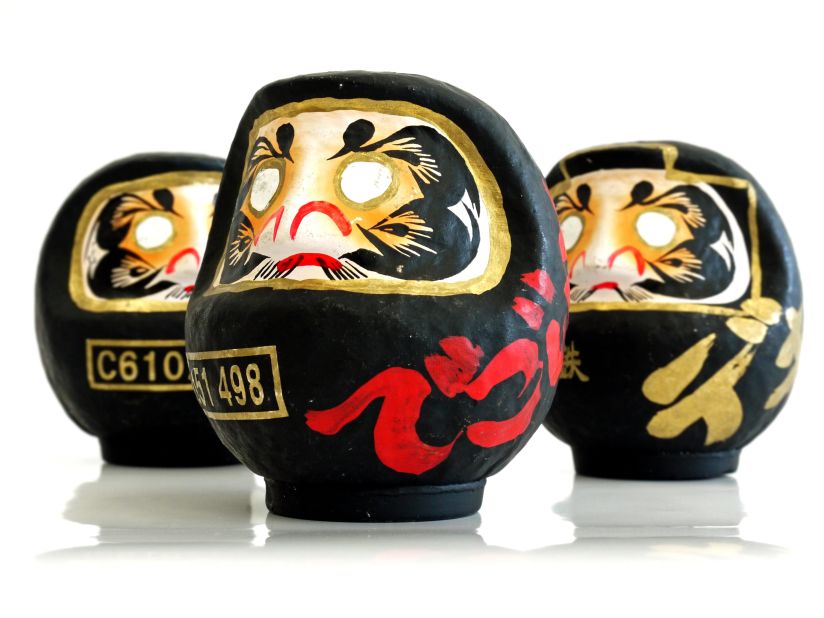 These daruma dolls were designed for the East Japan Railway Company to commemorate certain models of steam train.
