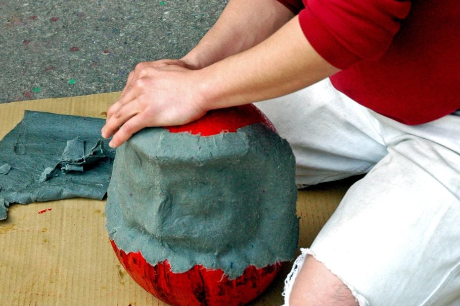 Artisans used to make daruma dolls by sticking layers of special Japanese paper, called washi, onto a wooden mold.