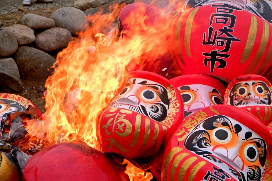 Daruma dolls are consumed by flames and returned to the earth as ash.