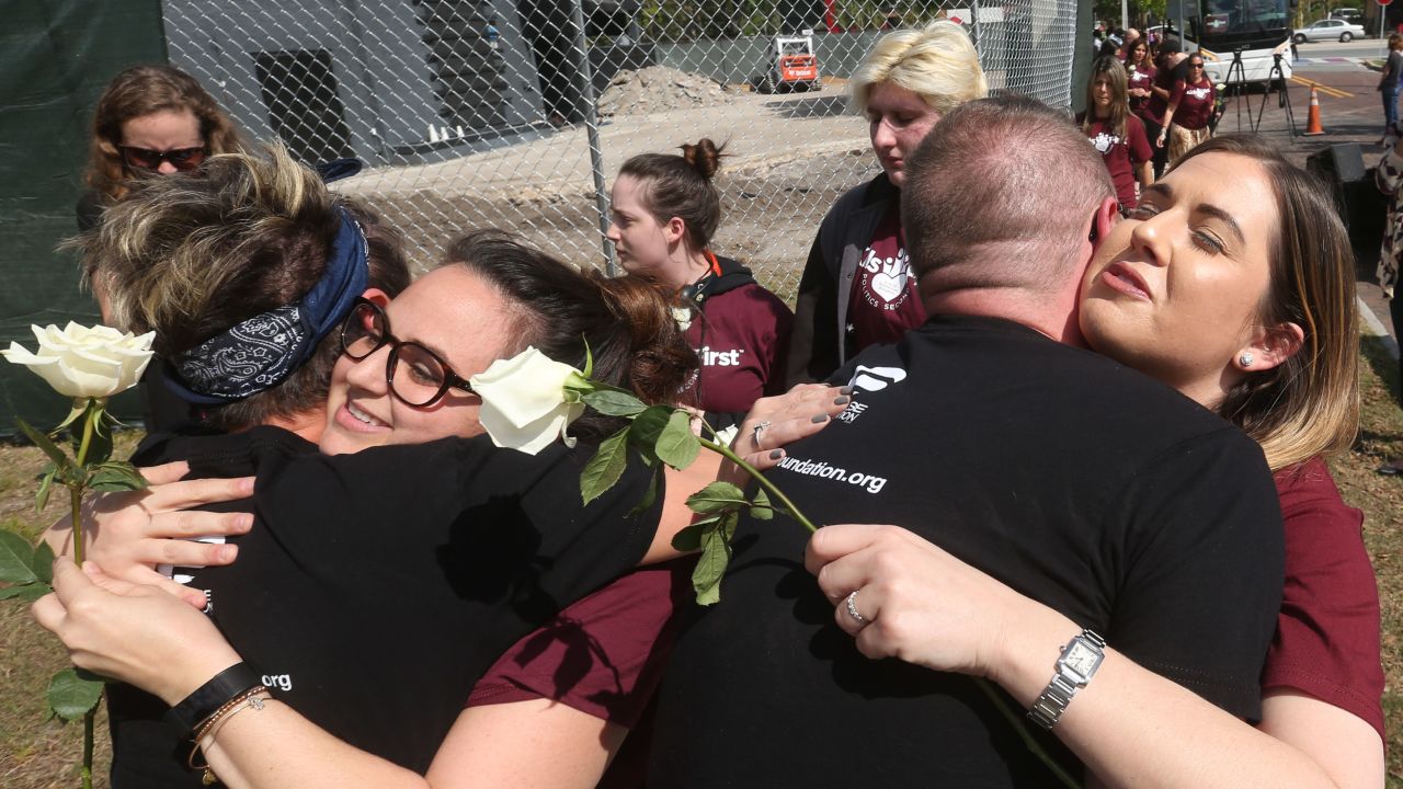 The Marjory Stoneman Douglas contingent (in burgundy) receives a warm welcome in Orlando.