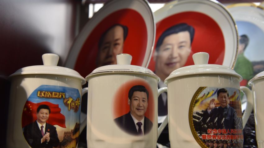 Decorative plates and cups featuring images of Chinese President Xi Jinping are seen in front of a plate featuring late communist leader Mao Zedong (top L) at a souvenir store next to Tiananmen Square in Beijing on February 27, 2018.
China's propaganda machine kicked into overdrive on February 27 to defend the Communist Party's move to scrap term limits for President Xi Jinping as critics on social media again defied censorship attempts. The country has shocked many observers by proposing a constitutional amendment to end the two-term limit for presidents, giving Xi a clear path to rule the world's second largest economy for life. / AFP PHOTO / GREG BAKER        (Photo credit should read GREG BAKER/AFP/Getty Images)