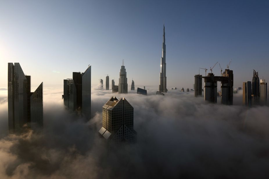 <strong>Head in the clouds:</strong> The $1.5 billion record-breeaking Burj Khalifa stands 2,716 feet (828 meters) tall and boasts 200 stories. It took 12,000 workers six years to build and opened in 2010.