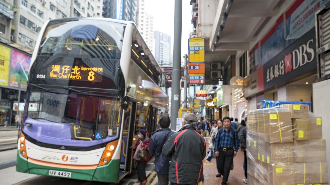 People board one of many buses that serve them regularly in Hong Kong.