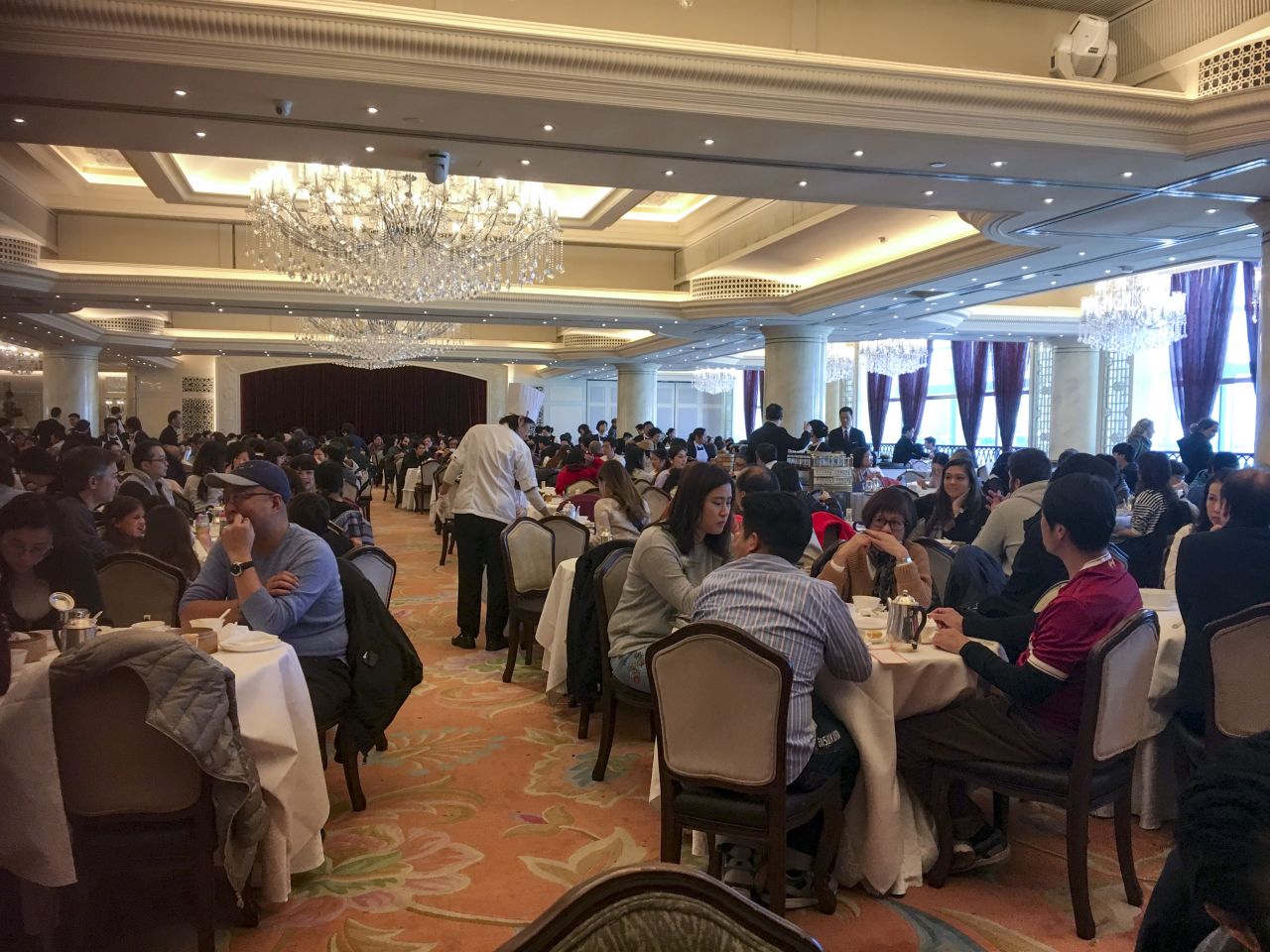 Families dine at Maxim's palace in City Hall. On Sunday afternoons, large families often venture out together for dim sum. The close familial networks of Asian cultures in general is well-known, providing both financial and social support as people get older. 