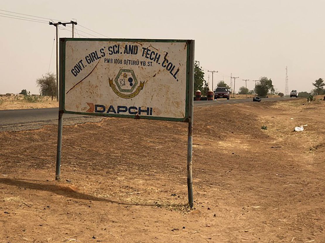 A dusty sign along the road to the school on Dapchi's outskirts.