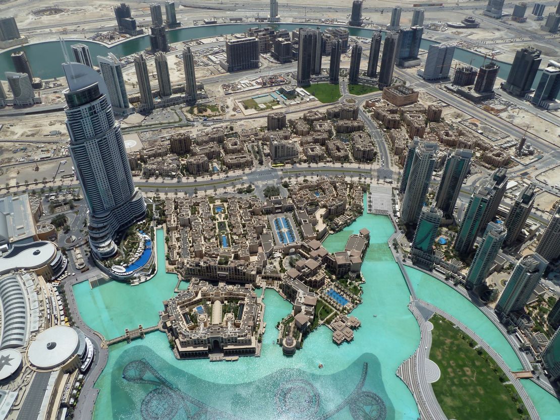 The Burj Khalifa overlooks the Dubai Fountain, Burj Park, Downtown Dubai and the Dubai Mall.