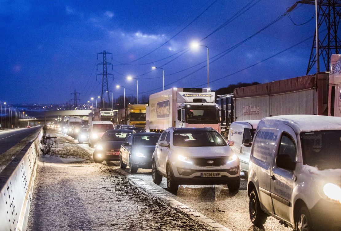 Cars and trucks inch along a motorway in northern England on Thursday.