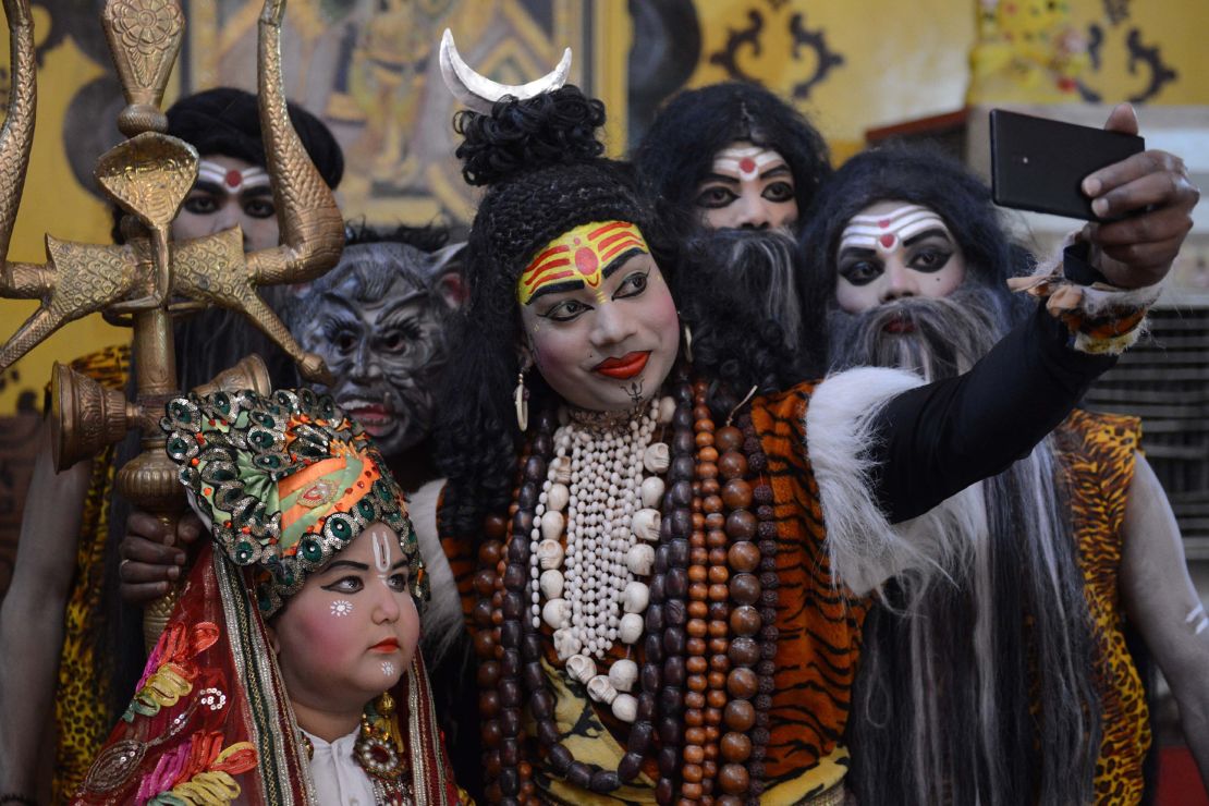 An Indian artist dressed as Hindu god Lord Shiva takes part in a procession ahead of the Holi festival in Amritsar in 2018. 
