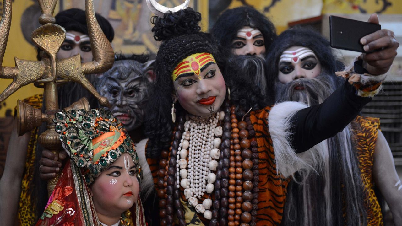 An Indian artist dressed as Hindu god Lord Shiva takes part in a procession ahead of the Holi festival in Amritsar on February 26, 2018.