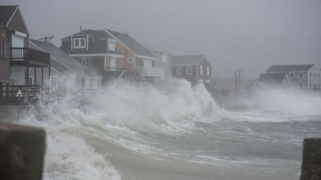 Waves crash against homes in Scituate, Massachusetts, on Friday, March 2. A powerful nor'easter morphed into a "bomb cyclone," bringing rain, snow and heavy winds to parts of the East Coast.