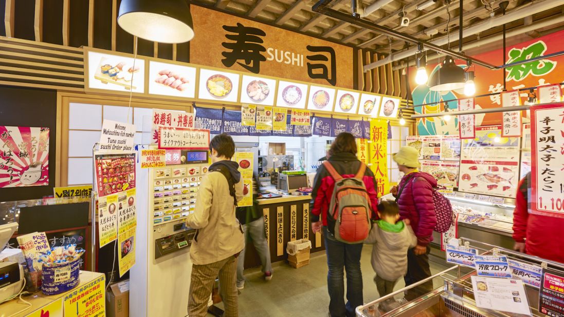 <strong>More than just oysters:</strong> Fish market visitors can order from a variety of vendors serving everything from ramen to sushi.
