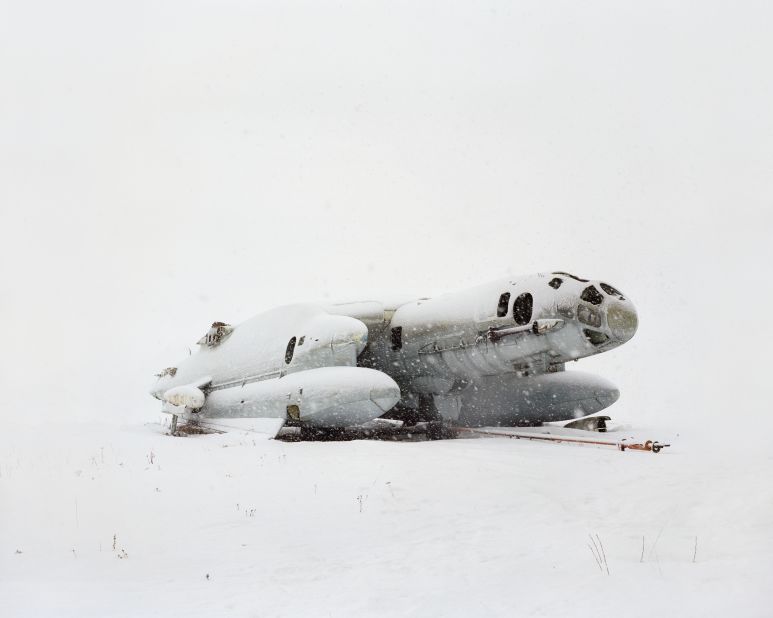 A Bartini Beriev VVA-14 amphibious aircraft built in 1972, one of only two ever made, lies in dilapidated condition at the Central Air Force Museum in the Monino Airfield, about 25 miles from Moscow. The photo is part of a series called "Restricted Areas," completed over three winters in snowy conditions by Russian photographer Danila Tkachenko.