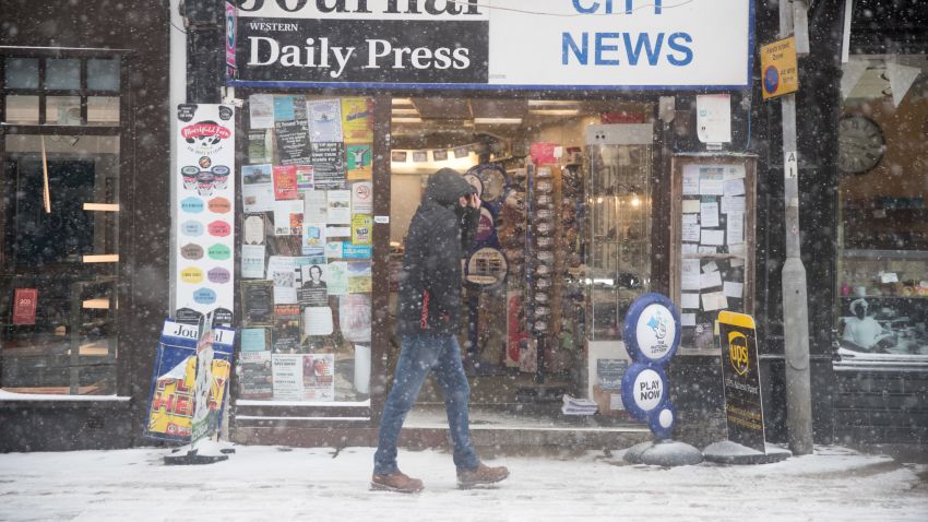 WELLS, UNITED KINGDOM - MARCH 01:  People walk around the near empty main shopping street as the forecasted snow arrives in Wells on March 1, 2018 in Somerset, England. Freezing weather conditions dubbed the "Beast from the East" combines with Storm Emma coming in from the South West of Britain to bring further snow and sub-zero temperatures causing chaos on roads and shutting schools. Red weather warnings for snow have been seen in the UK for the first time and five people have died as a result.  (Photo by Matt Cardy/Getty Images)