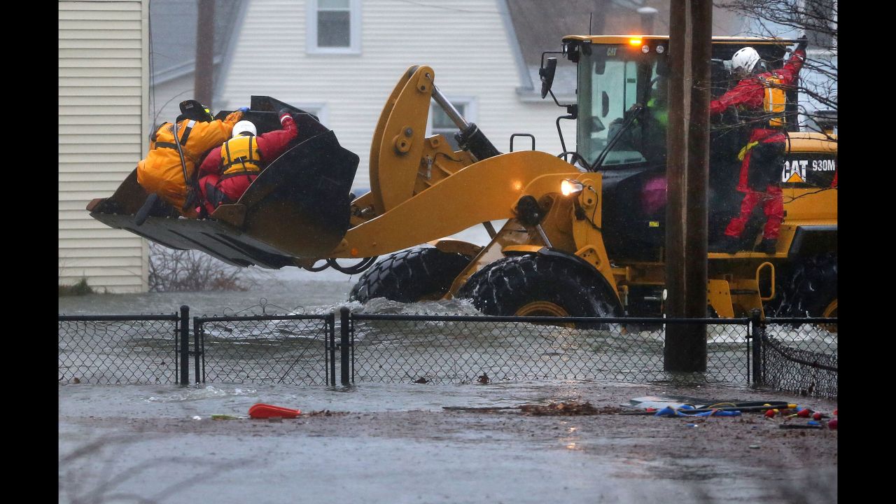 Rescue crews secure residents in the bucket of a front end loader in the Boston suburb of Quincy on March 2.