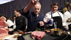 HOLLYWOOD, CA - MARCH 01: Master Chef Wolfgang Puck sprinkles salt on a Miyazaki Wagyu Beef with chef Eric Klein looking on during 90th Annual Academy Awards Governors Ball Press Preview on March 1, 2018 in Hollywood, California. (Photo by Kevork Djansezian/Getty Images)
