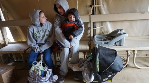 The Fitzgerald family being rescued with their 1-year-old daughter and 3-year-old son in Quincy, Massachusetts, on March 3, 2018.