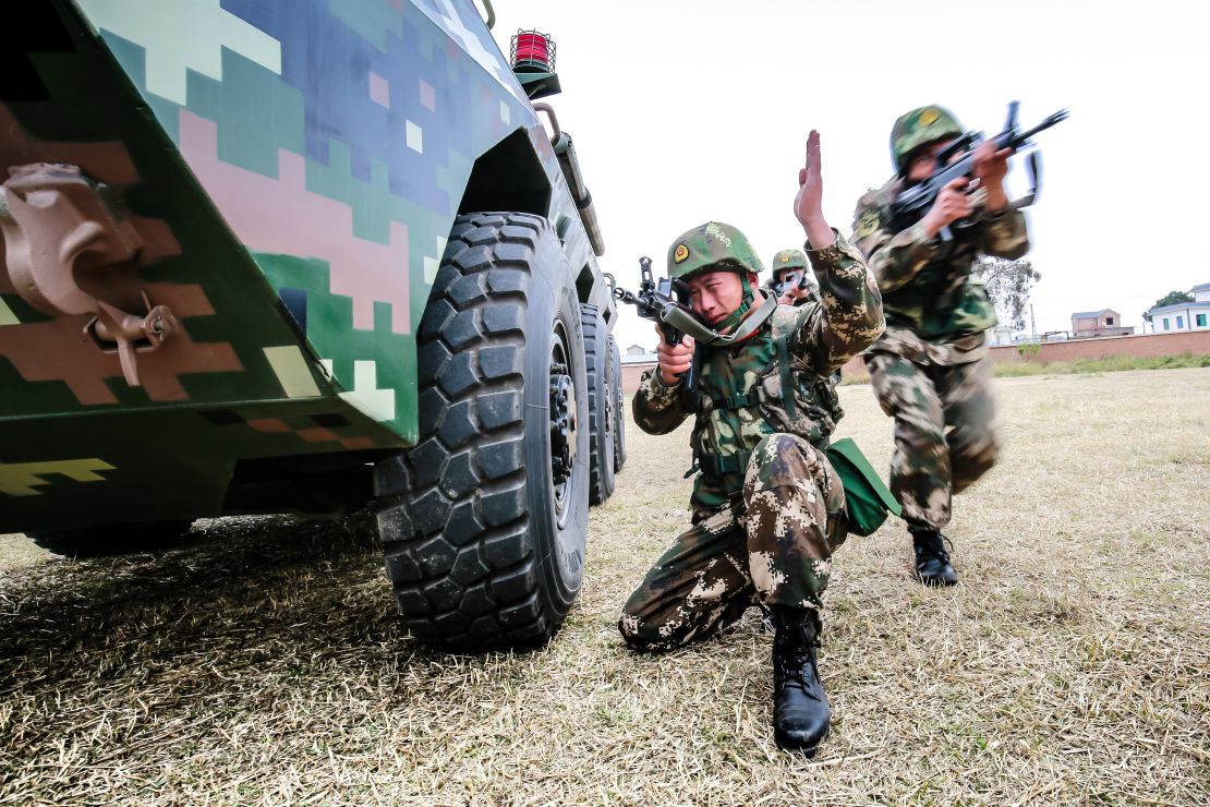 Chinese troops particpate in an anti-riot armored-vehicle training exercise on February 10, 2018, Yunnan province.