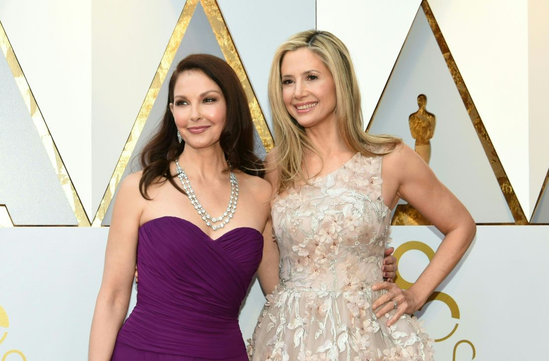 Ashley Judd (L) and Mira Sorvino arrive for the 90th Annual Academy Awards 