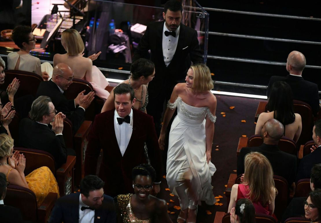 Comedian Jimmy Kimmel (C), Australian actress Margot Robbie (R), Israeli actress Gal Gadot (C,L) and actor Armie Hammer interact with movie goers at the Chinese theatre during the 90th Annual Academy Awards show on March 4, 2018 in Hollywood, California.