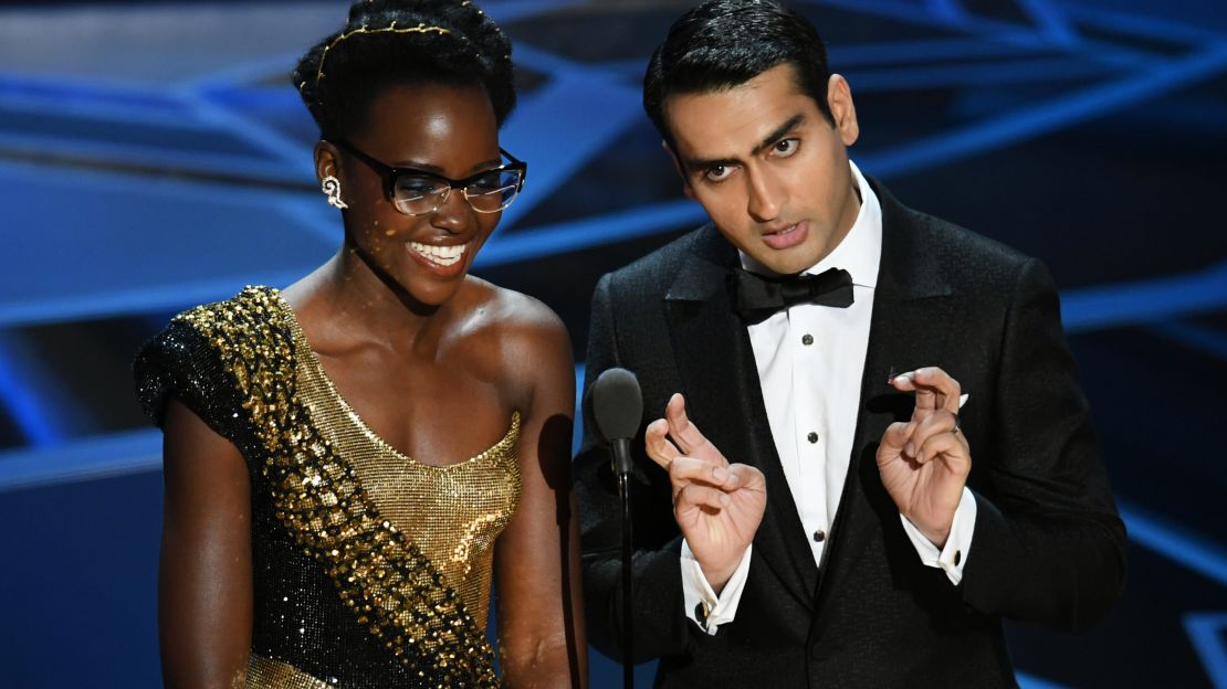Actors Lupita Nyong'o and Kumail Nanjiani speak onstage during the 90th Annual Academy Awards at the Dolby Theatre on March 4, 2018