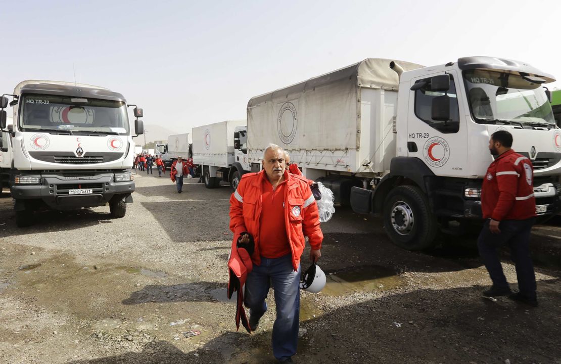 Vehicles carrying aid wait at the al-Wafideen checkpoint on the outskirts of Damascus.