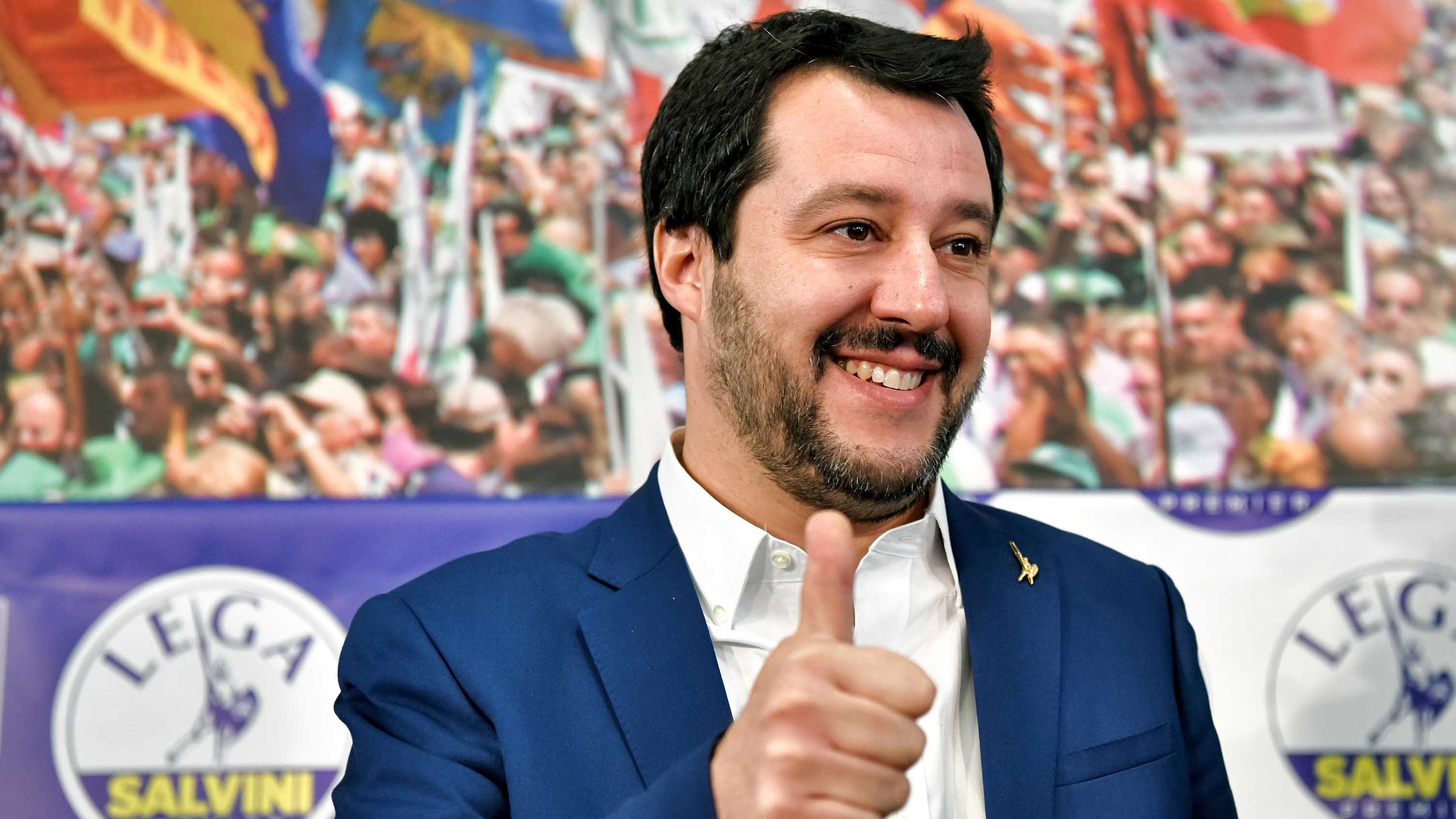 Salvini gives a thumb's up at League headquarters in Milan on Monday morning. 