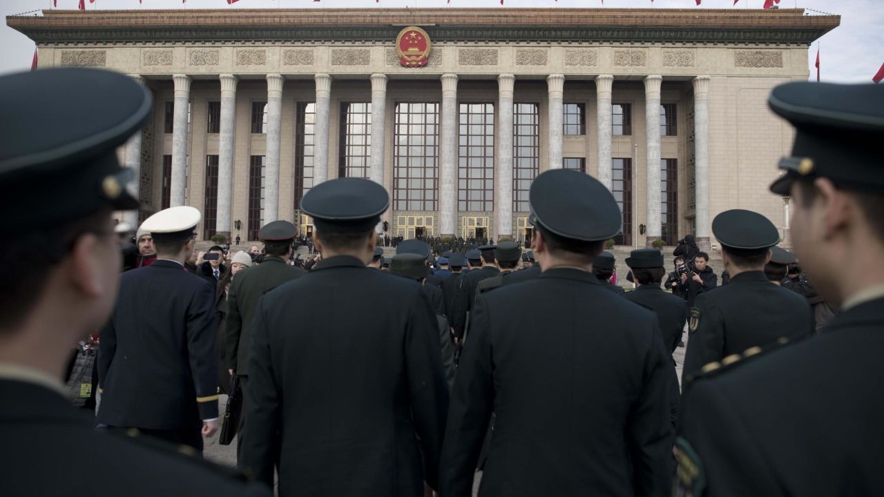 Military delegates arrive for the opening session of the National People's Congress, China's legislature, in Beijing's Great Hall of the People on March 5, 2018.

