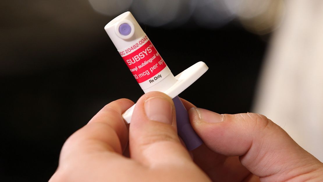 Angela Cantone holds an opioid called Subsys that her doctor prescribed to treat her prain from Crohn's disease.