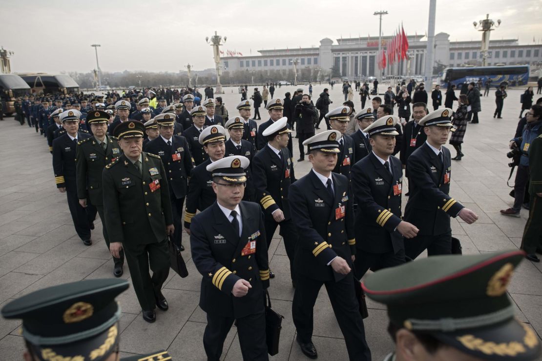 Military delegates arrive for the opening session of the National People's Congress, China's legislature, in Beijing's Great Hall of the People on March 5, 2018.

