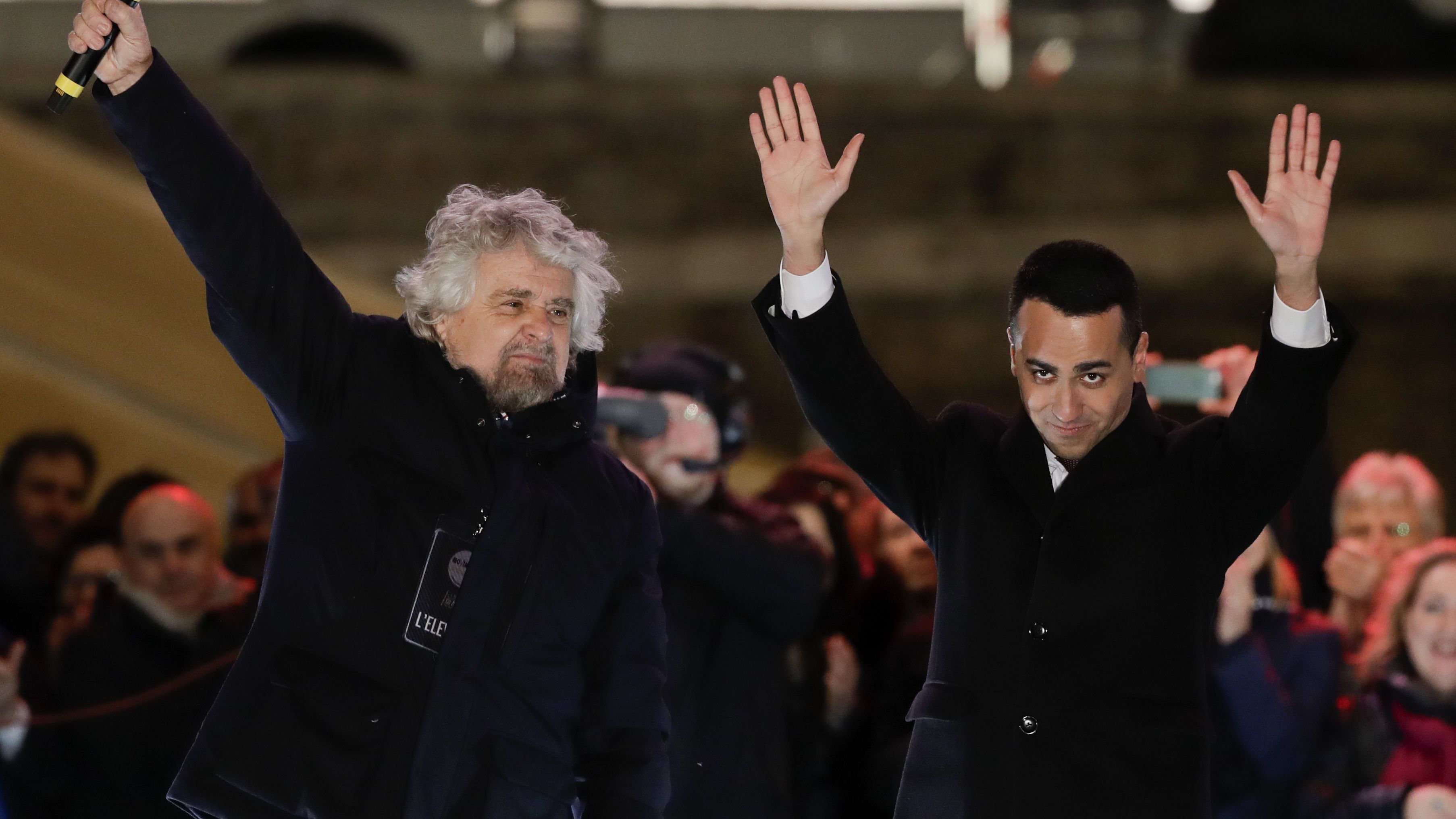 M5S leader Luigi Di Maio (R) and party founder Beppe Grillo (L) attend the party's final rally last Friday.  